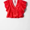 Bluse med volanger og V-hals Bluse med volanger og V-hals