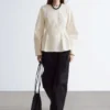 Peplum-top i bomull