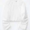 Skulpturell bluse med snøring